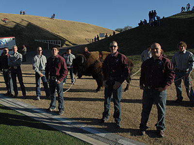 Herdsmen stand at attention off the field at Kimbrough Memorial Stadium.